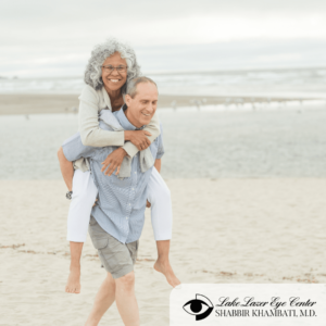 older happy couple on beach 